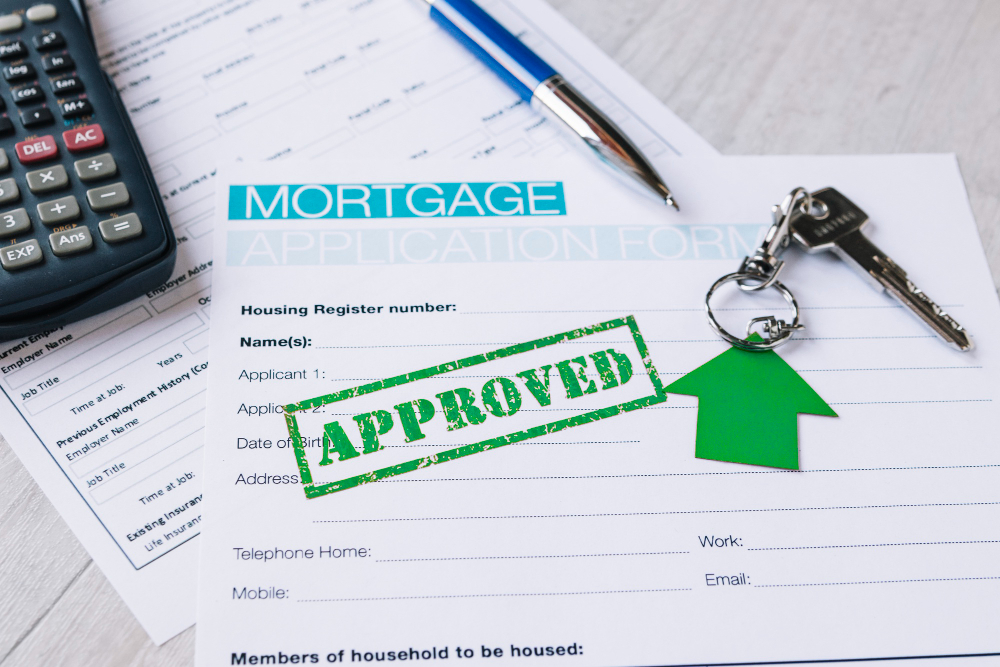 Mortgage application form with 'approved' stamp, house keys, calculator, and pen on a desk, showcased on our Service Page for optimal SEO.